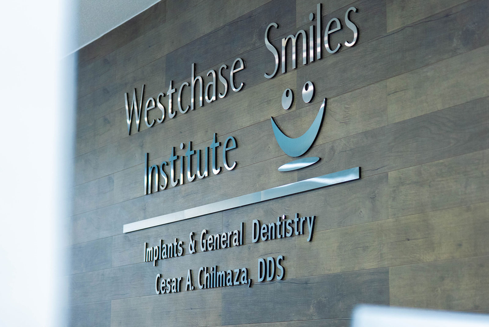 metal sign Westchase Smiles Institute