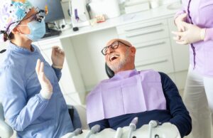 A concerned patient is talking to a friendly oral surgeon in a modern Tampa, Florida dental office about affordable oral surgery options. No text on the image.